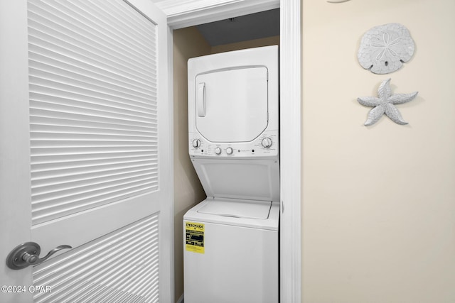 laundry area featuring stacked washer and clothes dryer