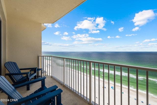 balcony with a beach view and a water view