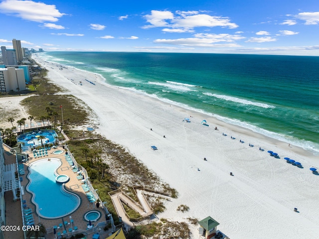 bird's eye view with a water view and a view of the beach