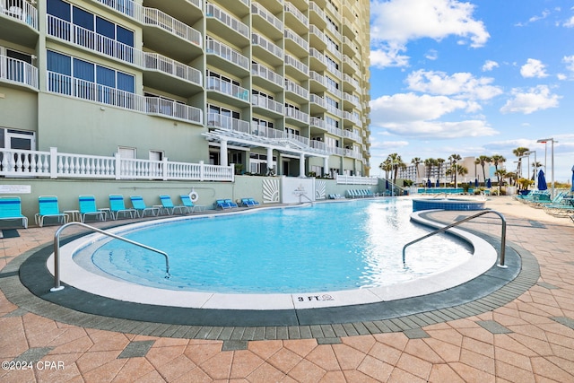 view of swimming pool featuring a patio