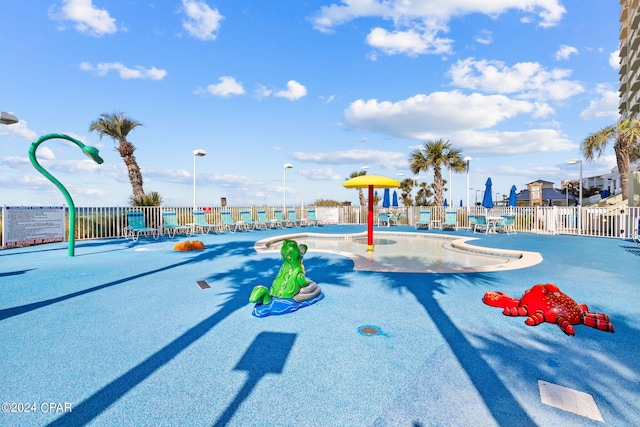 view of playground with a community pool