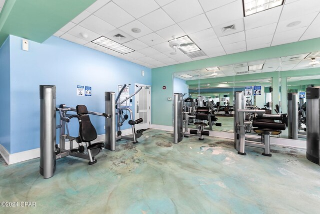 exercise room featuring a drop ceiling