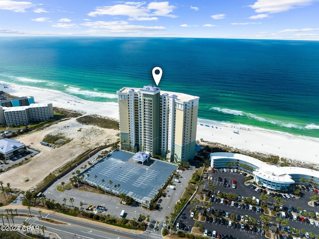 birds eye view of property with a view of the beach and a water view