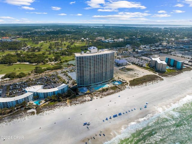 drone / aerial view with a water view and a beach view