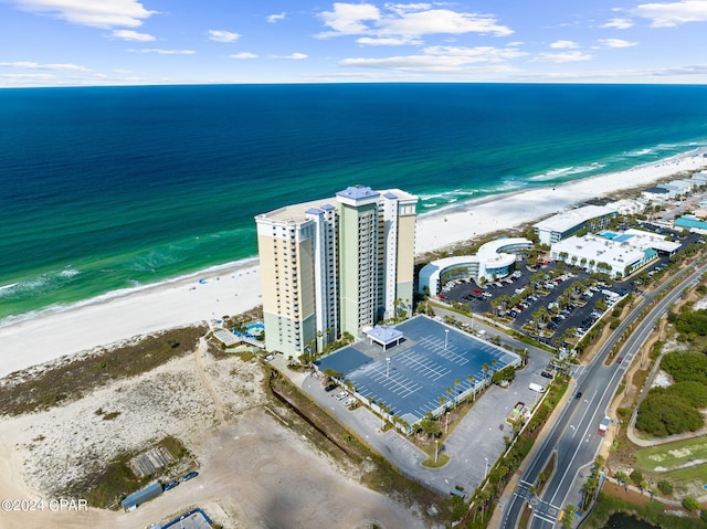 birds eye view of property with a beach view and a water view