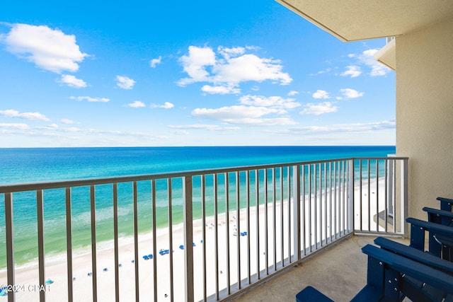 balcony with a view of the beach and a water view