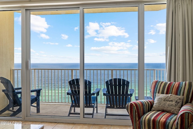 sunroom with a water view