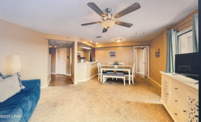 living room featuring ceiling fan and carpet floors