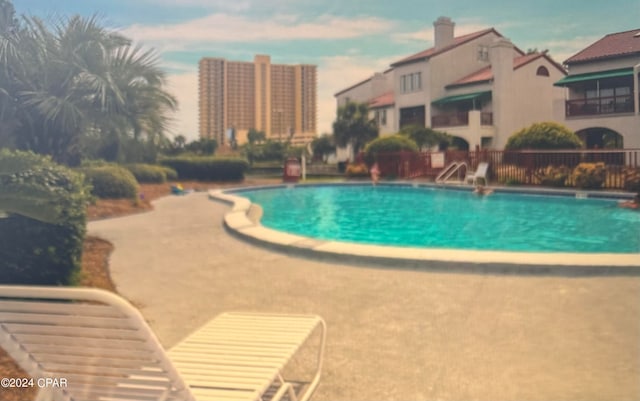 view of pool featuring a patio area