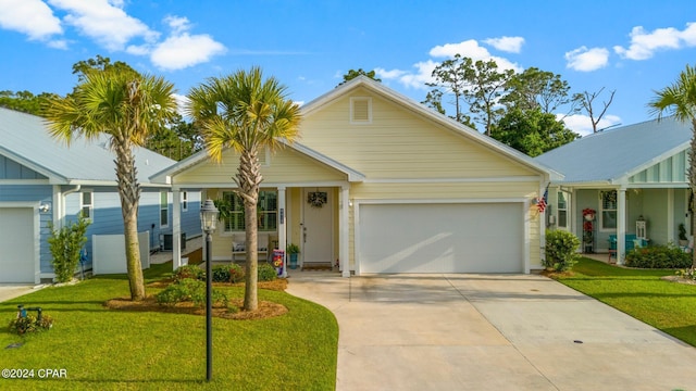 view of front of home with a garage and a front lawn