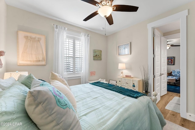 bedroom featuring hardwood / wood-style floors and ceiling fan