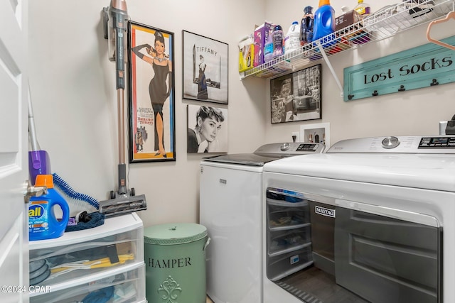 clothes washing area featuring washing machine and dryer and hookup for a washing machine