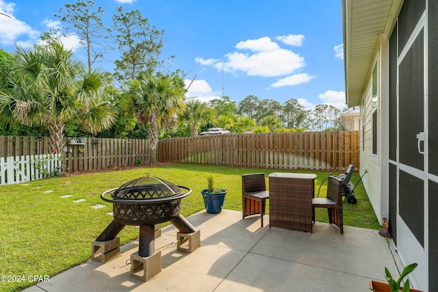 view of terrace featuring an outdoor fire pit