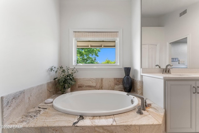 bathroom featuring vanity with extensive cabinet space