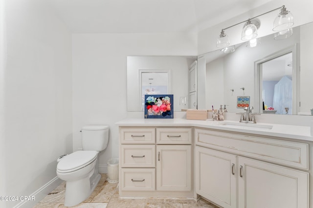 bathroom with tile flooring, toilet, and oversized vanity