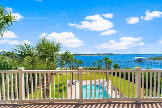 wooden deck with a patio and a water view