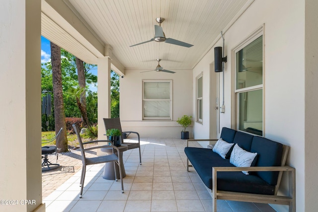 view of terrace with ceiling fan and an outdoor living space