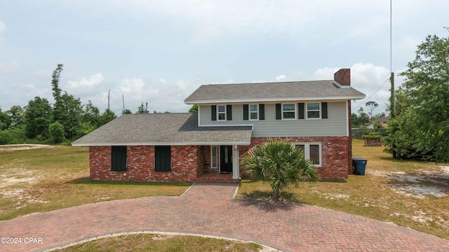 view of front of home featuring a front yard