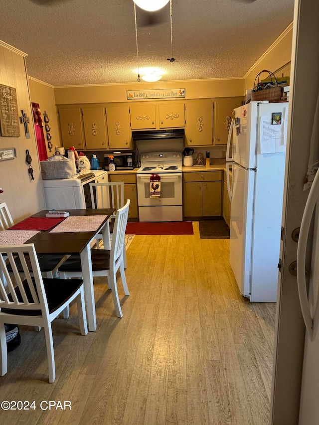 kitchen with white appliances, crown molding, washer / dryer, and light wood-type flooring