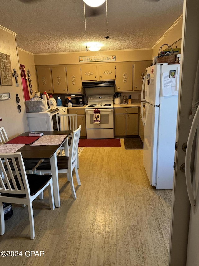 kitchen featuring white appliances, ornamental molding, light wood finished floors, and a textured ceiling