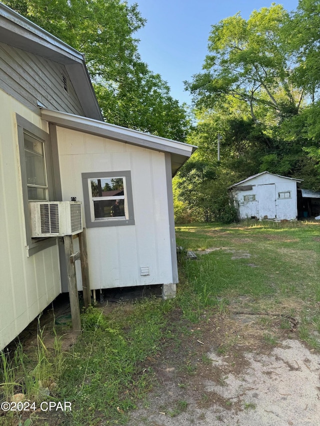 view of outbuilding with cooling unit