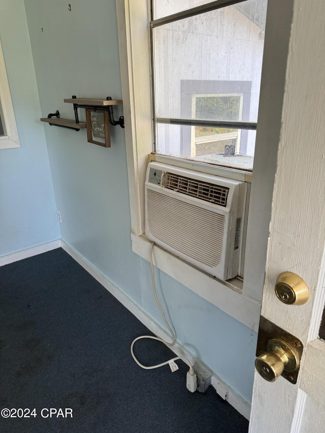 details with cooling unit, carpet flooring, and baseboards