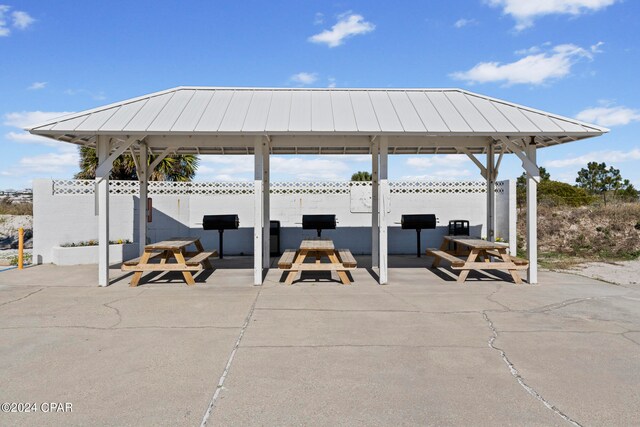 view of patio with an outdoor living space and a gazebo