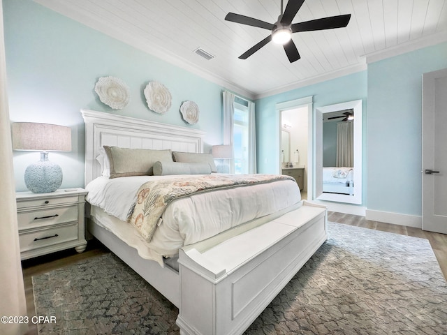 bedroom featuring wooden ceiling, ceiling fan, connected bathroom, and dark hardwood / wood-style flooring