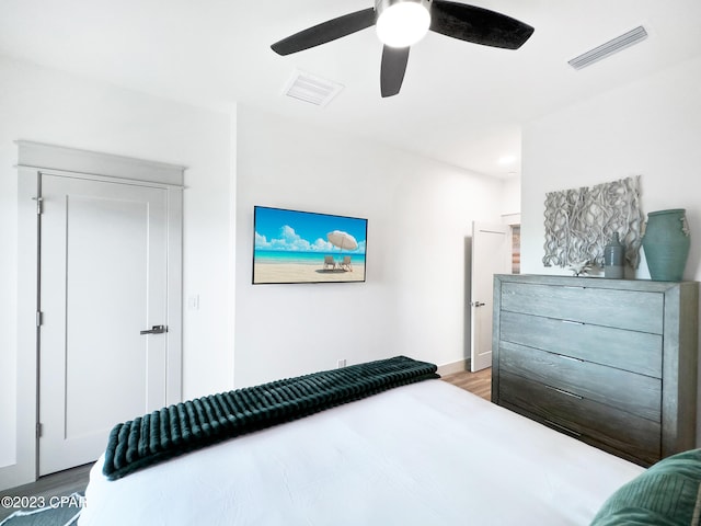 bedroom featuring light wood-type flooring and ceiling fan