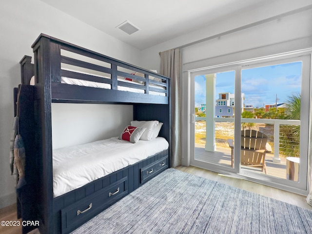 bedroom featuring access to outside and light hardwood / wood-style flooring