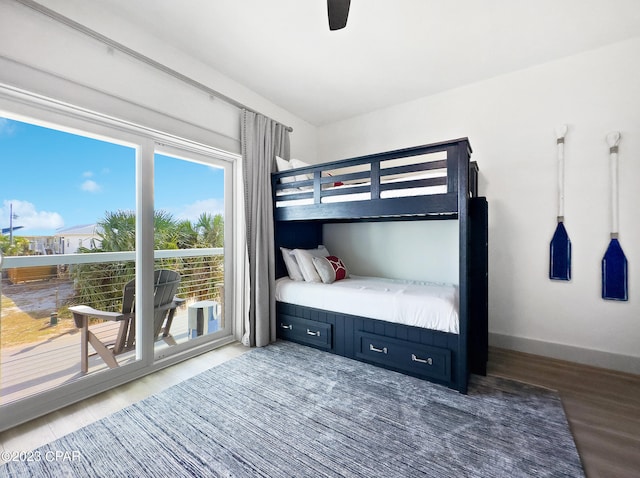 bedroom with light wood-type flooring and access to outside