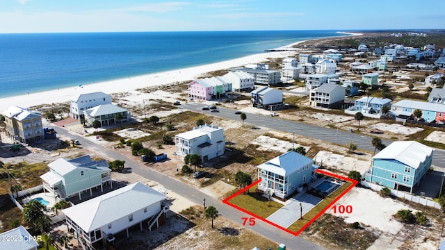 aerial view with a beach view and a water view