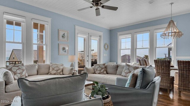 living room with dark wood-type flooring, ceiling fan with notable chandelier, and wooden ceiling