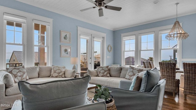 living room with dark hardwood / wood-style flooring, wood ceiling, and ceiling fan with notable chandelier