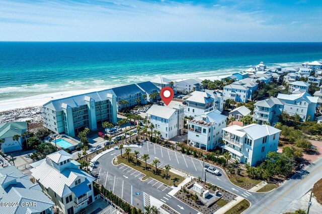 aerial view featuring a water view and a beach view