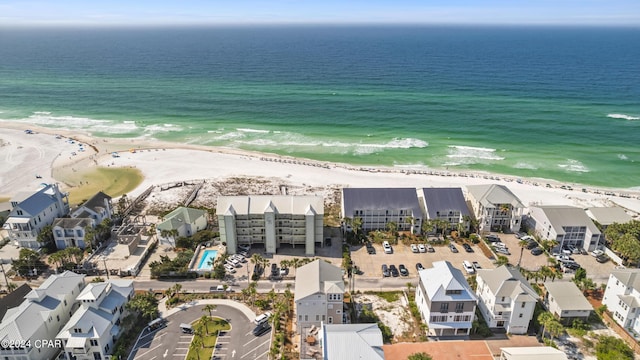 birds eye view of property featuring a water view and a view of the beach