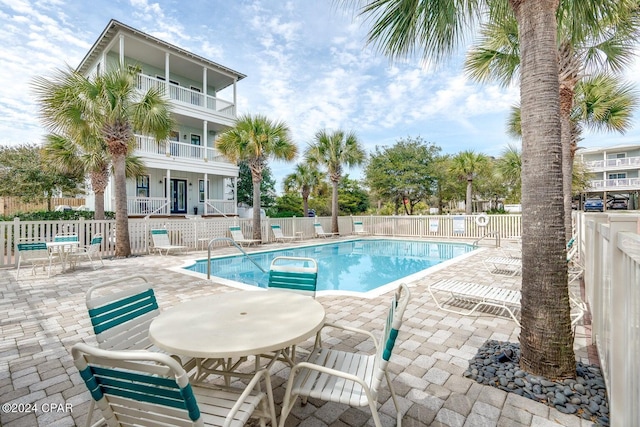 view of pool featuring a patio area