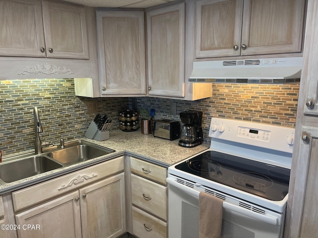 kitchen featuring backsplash, light brown cabinetry, sink, and white electric range oven