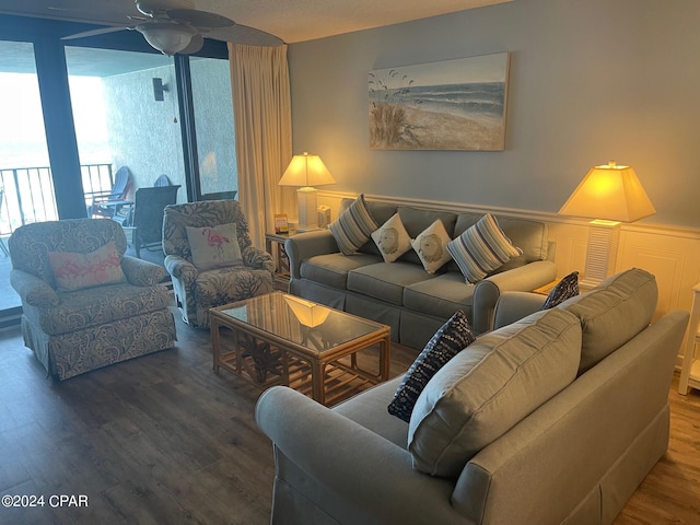 living room featuring ceiling fan and wood-type flooring