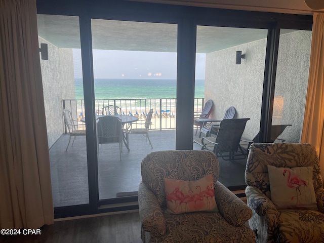 interior space with a view of the beach and a water view