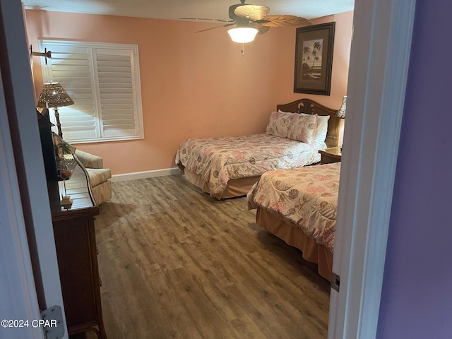 bedroom featuring ceiling fan and hardwood / wood-style floors