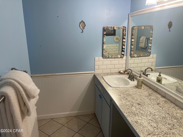 bathroom with tile patterned flooring and vanity