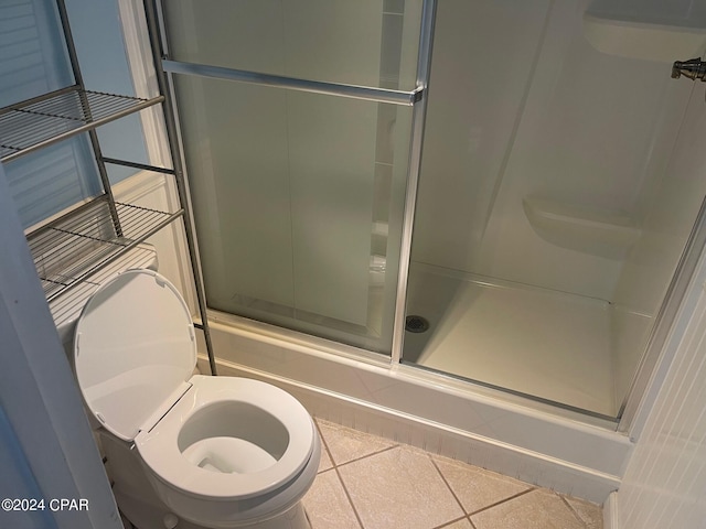 bathroom featuring tile patterned floors and toilet