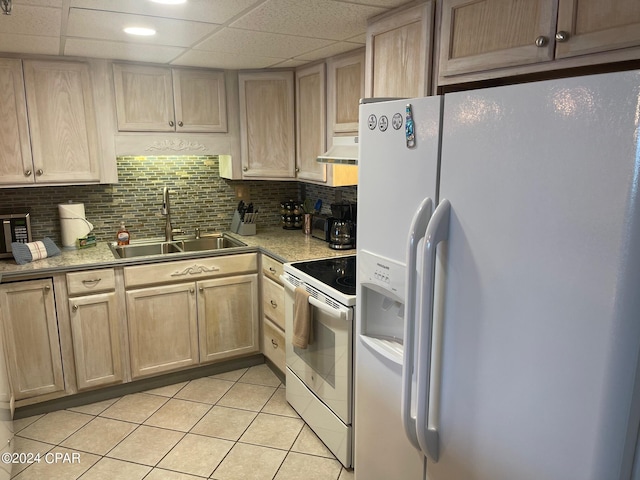 kitchen featuring tasteful backsplash, white appliances, ventilation hood, sink, and light tile patterned flooring