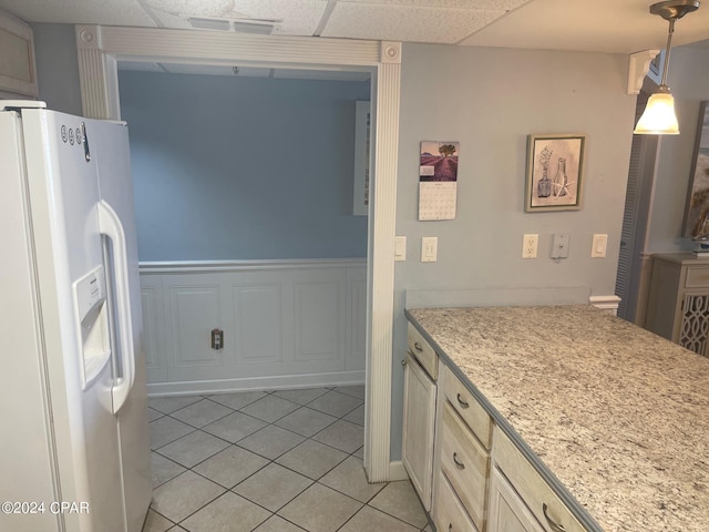 bathroom with tile patterned flooring and a paneled ceiling