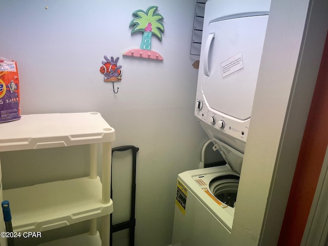 laundry room featuring stacked washer and clothes dryer