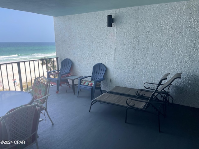 balcony with a view of the beach and a water view