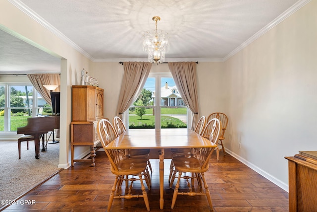 dining space featuring an inviting chandelier, a textured ceiling, dark hardwood / wood-style floors, and crown molding