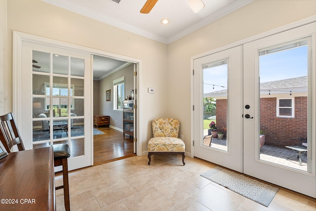 entryway featuring light tile patterned floors, crown molding, french doors, and ceiling fan