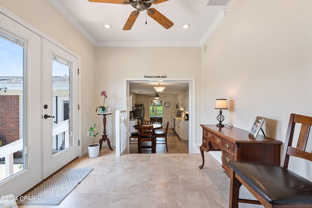 entryway with french doors, ceiling fan, light tile floors, and crown molding